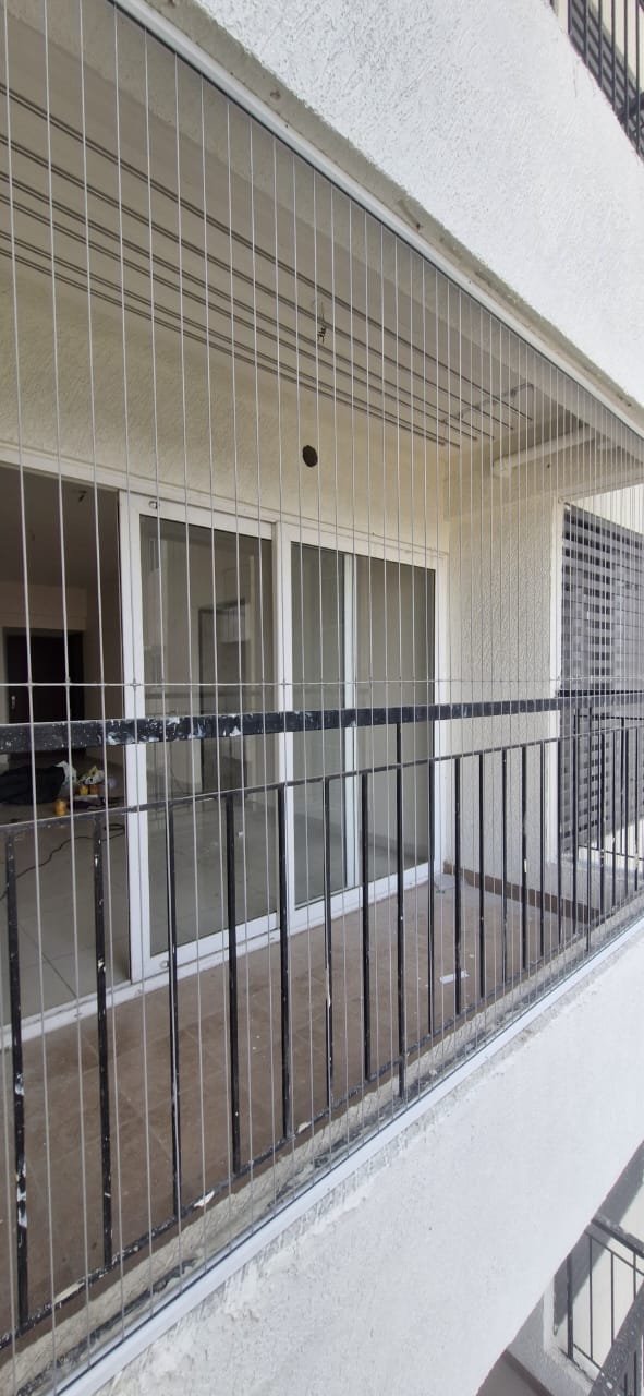 Balcony invisible grill installation on a high-rise apartment in Chennai