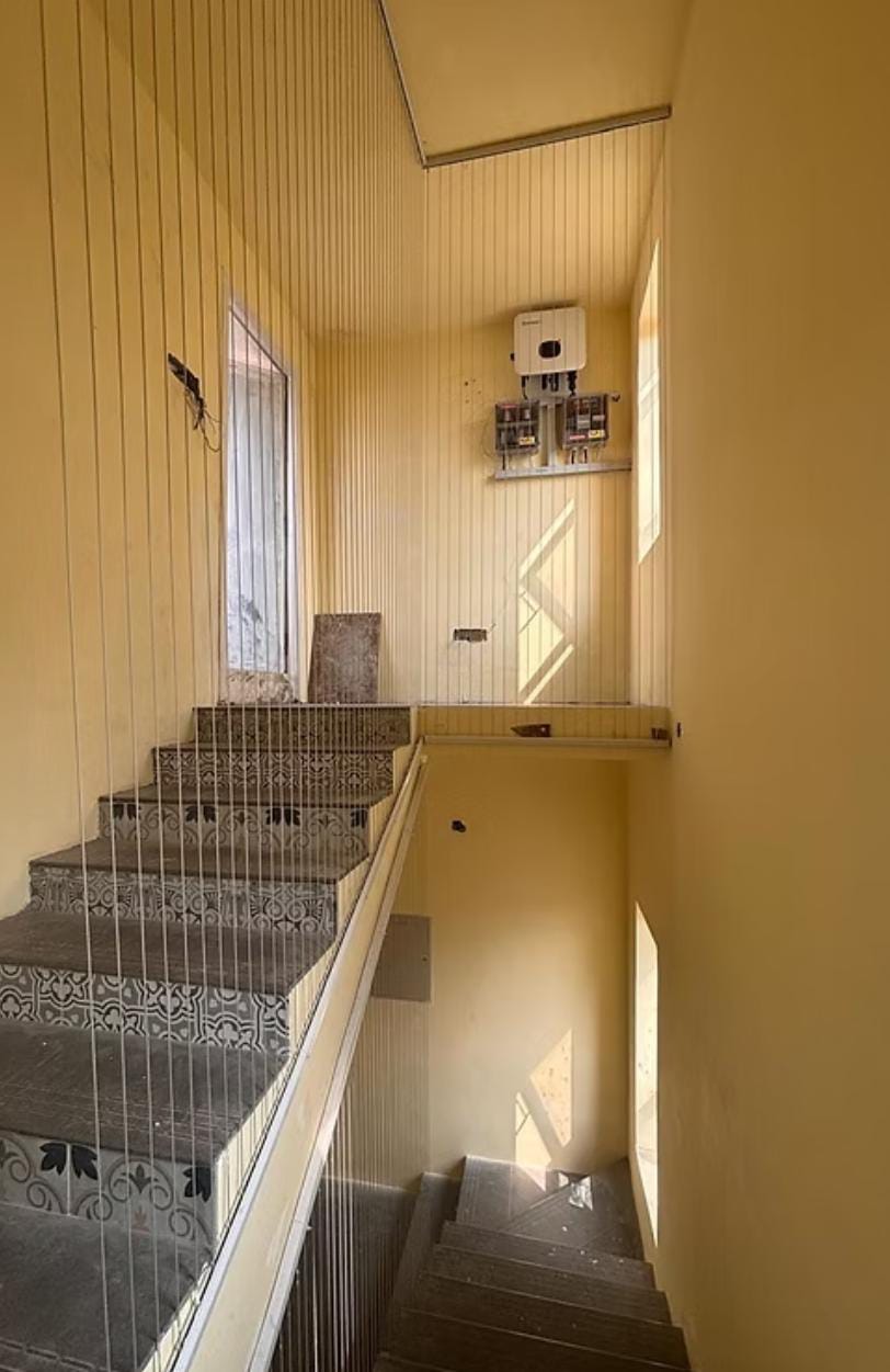 Staircase invisible grills on an open stair flight in a Chennai home